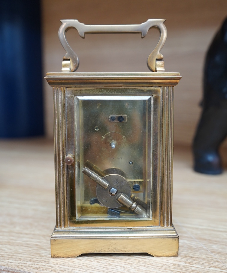 A French eight day carriage timepiece, 11.5cm high. Condition - fair to good.